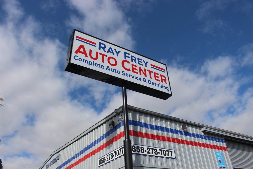 Ray Frey Auto Center sign against the sky